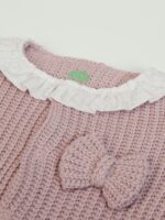 Tutina maglia neonata Tutina in maglia per neonata senza piedini, apertura davanti e al cavallo con bottoncini snap.